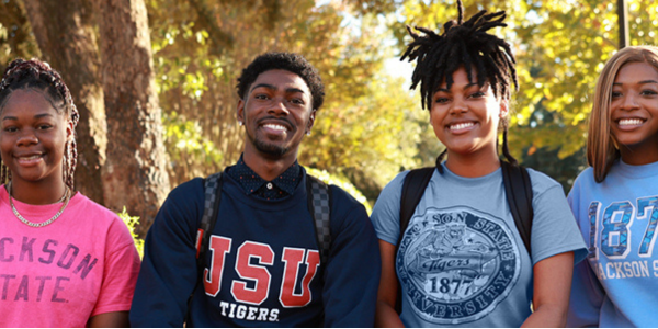 a group of Black students from diverse cultures standing together, smiling