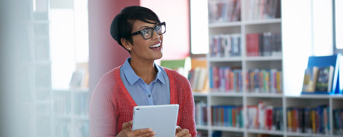 Teacher in Library with computer